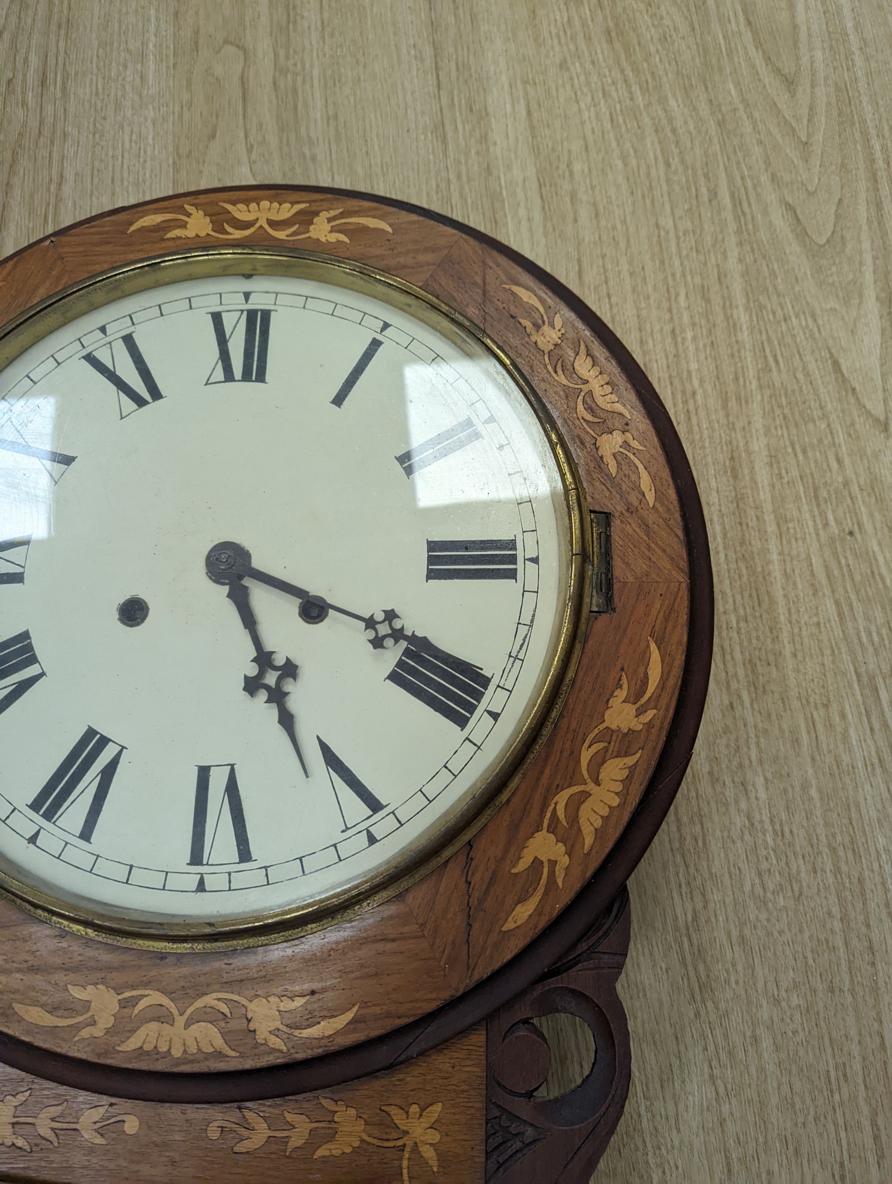 An American marquetry drop dial wall clock, 27cm enamelled dial, with key and pendulum